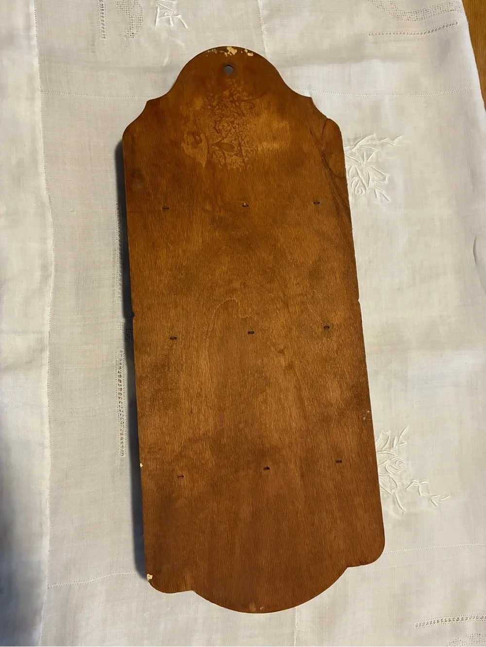 Vintage wood spoon holder with wheat design at the too.